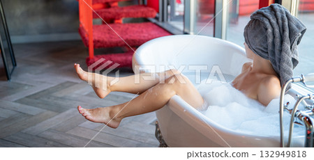 Woman feet in bathrobe at home, closeup Woman feet in bathrobe at home, closeup 132949818