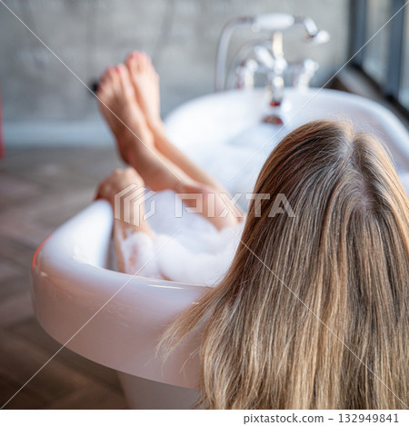 Woman feet in bathrobe at home, closeup Woman feet in bathrobe at home, closeup 132949841