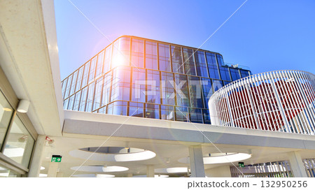 Exterior of modern high-rise buildings in a business district. Tall office buildings. Glass-fronted skyscrapers. Modern business district. Exterior of modern high-rise buildings in a business district. Tall office buildings. Glass-fronted skyscrapers. Modern business district. 132950256