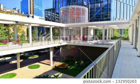 Exterior of modern high-rise buildings in a business district. Tall office buildings. Glass-fronted skyscrapers. Modern business district. 132950263