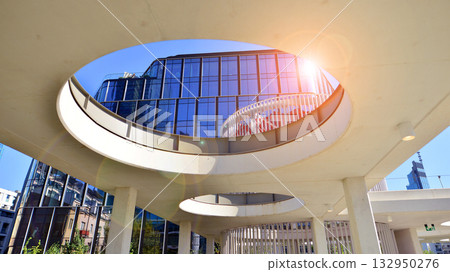 Exterior of modern high-rise buildings in a business district. Tall office buildings. Glass-fronted skyscrapers. Modern business district. 132950276