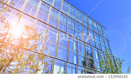 Exterior of modern high-rise buildings in a business district. Tall office buildings. Glass-fronted skyscrapers. Modern business district. Exterior of modern high-rise buildings in a business district. Tall office buildings. Glass-fronted skyscrapers. Modern business district. 132950292