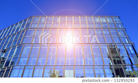 Exterior of modern high-rise buildings in a business district. Tall office buildings. Glass-fronted skyscrapers. Modern business district. Exterior of modern high-rise buildings in a business district. Tall office buildings. Glass-fronted skyscrapers. Modern business district. 132950293