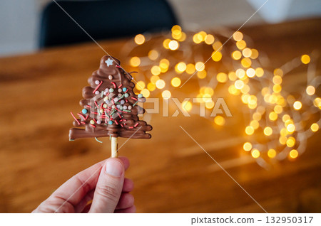 Chocolate Christmas tree candies, festive sweets for holiday table Chocolate Christmas tree candies, festive sweets for holiday table 132950317