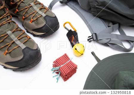 Bear bells and firecrackers (trekking poles, hiking boots, hat) Bear bells and firecrackers (trekking poles, hiking boots, hat) 132950818