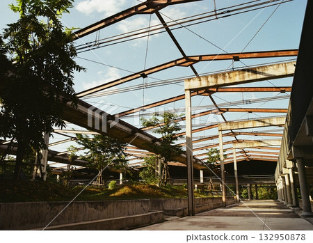 A park on the site of a former factory and blue skies 132950878