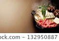 Luxurious sukiyaki pot with a bright wood grain background and vibrant ingredients 132950887