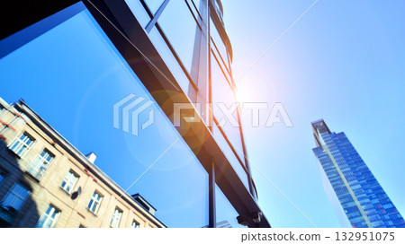 Exterior of modern high-rise buildings in a business district. Tall office buildings. Glass-fronted skyscrapers. Modern business district. Exterior of modern high-rise buildings in a business district. Tall office buildings. Glass-fronted skyscrapers. Modern business district. 132951075
