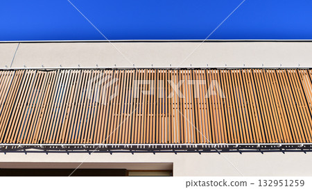 Newly built terraced houses in a residential area. Modern terraced houses on the outskirts of the city. Newly built terraced houses in a residential area. Modern terraced houses on the outskirts of the city. 132951259