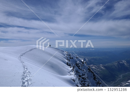 Tranquil Lake With Lush Green Forest, Snow-Capped Mountain, Blue Sky And White Clouds Tranquil Lake With Lush Green Forest, Snow-Capped Mountain, Blue Sky And White Clouds 132951286