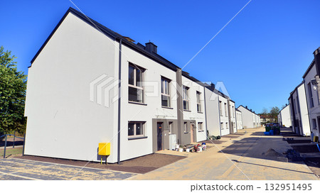 Terraced houses under construction. Housing estate development under construction. Terraced houses under construction. Housing estate development under construction. 132951495