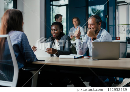 Diverse Business Team Meeting in Modern Glass Office Diverse Business Team Meeting in Modern Glass Office 132952389
