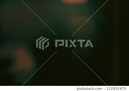 Green toned analog film grain texture with soft light leaks and matte glow 132952473