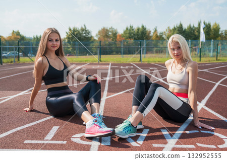 Two athlete young woman runner at the stadium 132952555