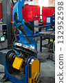 Automatic Industrial welding robot in a modern factory 132952598