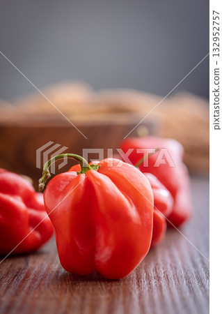 Red chili pepper habanero on wooden table. 132952757