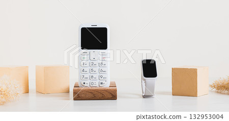 Synchronization of a retro push-button telephone and a fitness bracelet concept web banner Synchronization of a retro push-button telephone and a fitness bracelet concept web banner 132953004