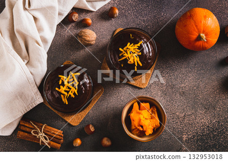Chocolate pumpkin mousse with orange zest in glasses on the table top view Chocolate pumpkin mousse with orange zest in glasses on the table top view 132953018