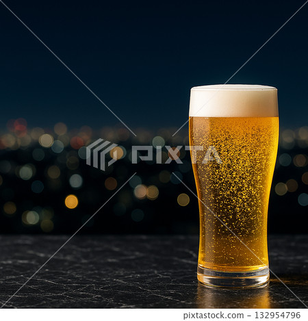 Night background and draft beer poured into a glass Night background and draft beer poured into a glass 132954796