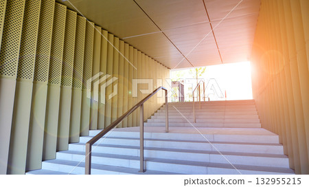 Modern architectural design of an exterior staircase with elegant features in a modern apartment estate. Modern architectural design of an exterior staircase with elegant features in a modern apartment estate. 132955215