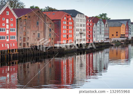 Old wooden houses on stilts line the old harbor in Trondheim, Norway 132955968