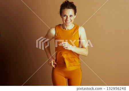 Motivated Woman Pointing Forward While Running Motivated Woman Pointing Forward While Running 132956248