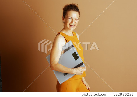 Joyful Woman Celebrating Health and Wellness Joyful Woman Celebrating Health and Wellness 132956255