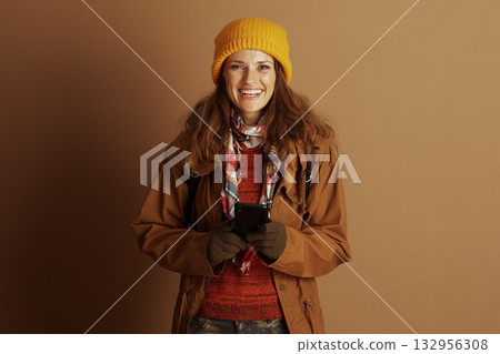 Cheerful Woman in Autumn Gear Smiling Wide at Camera Cheerful Woman in Autumn Gear Smiling Wide at Camera 132956308