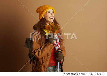 Joyful Hiker Laughing with Autumn Leaves and Gear Joyful Hiker Laughing with Autumn Leaves and Gear 132956310