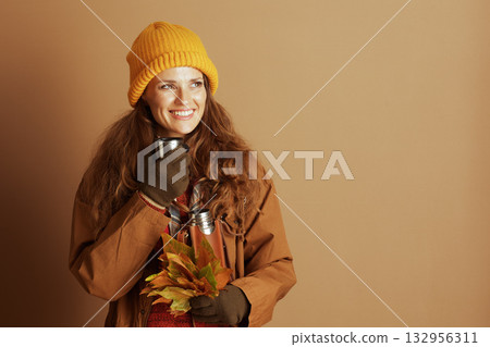 Woman Finding Coziness in Autumn Outdoors 132956311