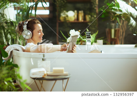 Blissful Bubble Bath with Headphones and Tablet 132956397