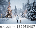 Walking with a pet on Christmas Eve. A woman walks her dog on a winter street, snow, garland lights, and holiday decorations 132956487