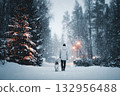 Walking with a pet on Christmas Eve. A man walks his dog on a winter street, snow, garland lights, and holiday decorations 132956488