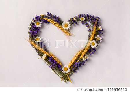 Heart Shape Made of Summer Flowers: Lavender, Chamomile, and Wheat Spikes on a Light Background. 132956810