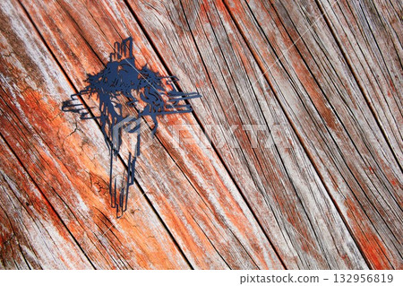 Black Cross Face On Wooden Texture 132956819