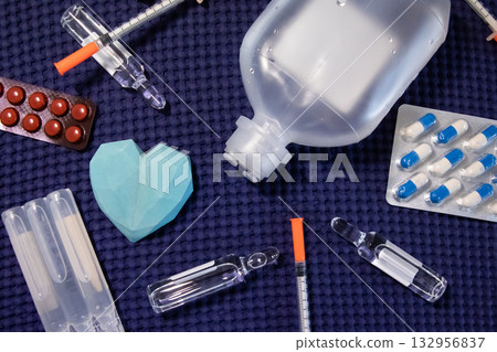 Medical supplies heart care drugs syringe ampoules background Medical supplies heart care drugs syringe ampoules background 132956837