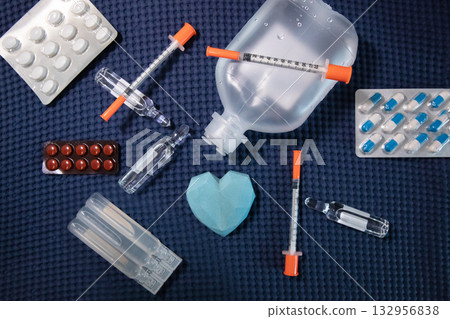 Medical supplies heart care drugs syringe ampoules background Medical supplies heart care drugs syringe ampoules background 132956838