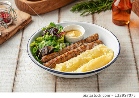 Sausages with mashed potatoes and mustard Sausages with mashed potatoes and mustard 132957073