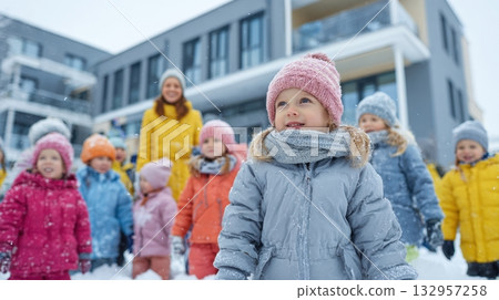 Children playing outside in winter at kindergarten 132957258