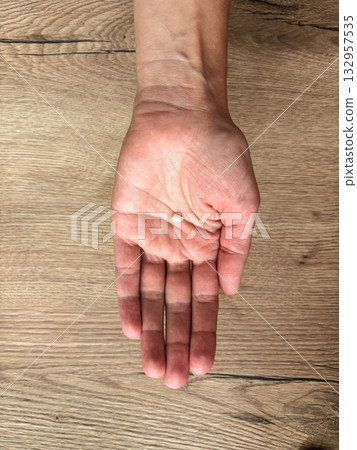 A baby milk tooth in the mother palm. A baby milk tooth in the mother palm. 132957535
