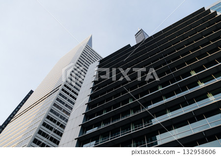 Architectural detail of modern skyscrapers in Chicago, USA, capturing a low-angle view. Architectural detail of modern skyscrapers in Chicago, USA, capturing a low-angle view. 132958606