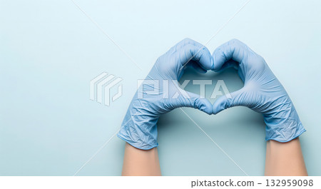 Hands in blue medical gloves forming a heart shape on a light blue background 132959098