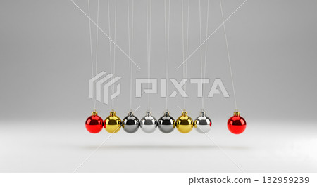 Newton's cradle with colorful Christmas ornaments on a white background 132959239