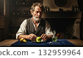 Elderly rural man in the kitchen eating fruit 132959964