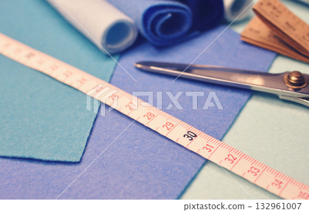 Cool-colored felt fabric and tape measure, scissors, handmade craft supplies 132961007