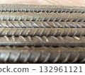 Black metal rebar pieces lying outside 132961121