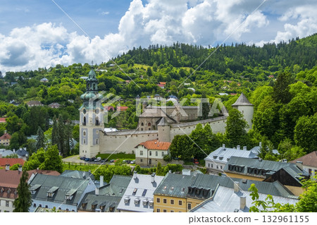 Captivating view of Banska Stiavnica's historic architecture and cobblestone roads under a dramatic sky. This picturesque setting captures the serenity of this historic town Captivating view of Banska Stiavnica's historic architecture and cobblestone roads under a dramatic sky. This picturesque setting captures the serenity of this historic town 132961155
