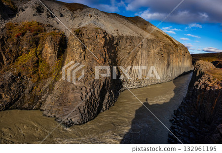 Studlagil Canyon in Iceland features striking basalt columns and a vibrant turquoise river. This natural landscape is ideal for hiking and photography, showcasing Iceland's unique geology. Studlagil Canyon in Iceland features striking basalt columns and a vibrant turquoise river. This natural landscape is ideal for hiking and photography, showcasing Iceland's unique geology. 132961195