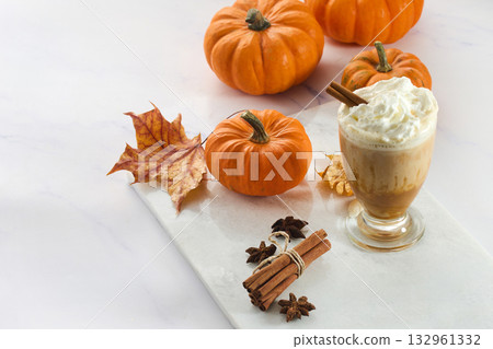 Autumn Pumpkin spice Latte Delight. Pumpkin spice lattes with cinnamon, pumpkin slices, and autumn leaves Autumn Pumpkin spice Latte Delight. Pumpkin spice lattes with cinnamon, pumpkin slices, and autumn leaves 132961332