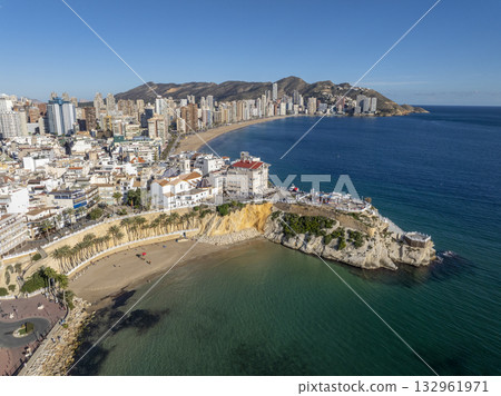 Aerial view of Benidorm, Spain, showcasing high-rise buildings and the Mediterranean Sea in the background. Aerial view of Benidorm, Spain, showcasing high-rise buildings and the Mediterranean Sea in the background. 132961971